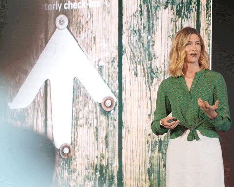 Charlotte Rush pictured on stage at Curious Thinkers 2024
